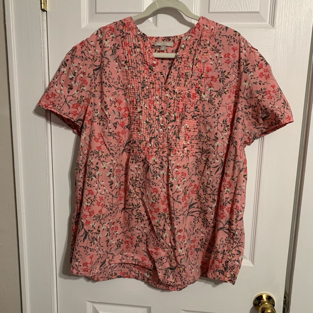 Woman within pink floral tunic style top